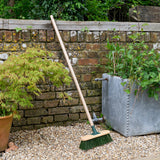 RHS-endorsed 12-inch garden brush with stiff PVC bristles, by Burgon & Ball